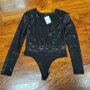 Black shiny body suit